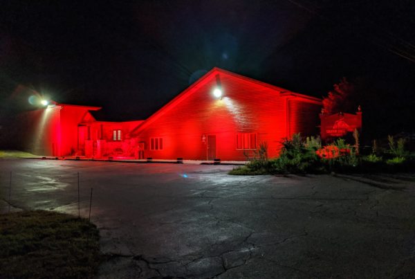 Creative Stage Lighting's North Creek, NY building lit red to support #WeMakeEvents, #redalertrestart, and #ExtendPUA