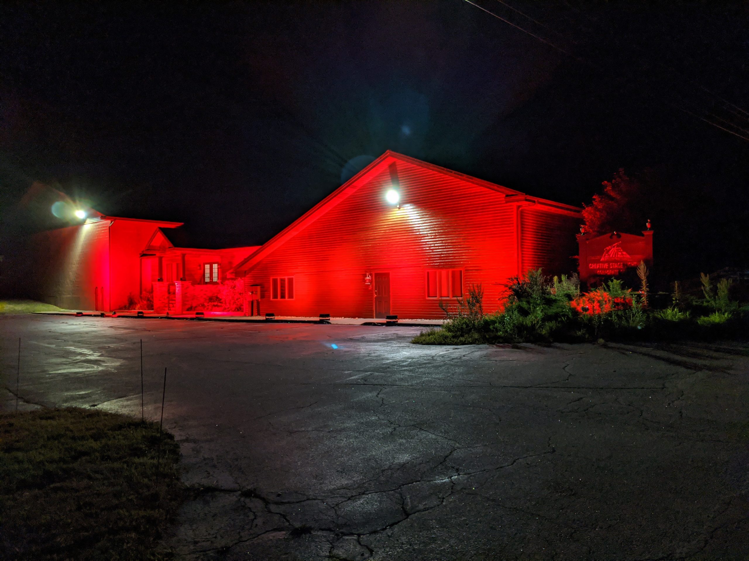Creative Stage Lighting's North Creek, NY building lit red to support #WeMakeEvents, #redalertrestart, and #ExtendPUA